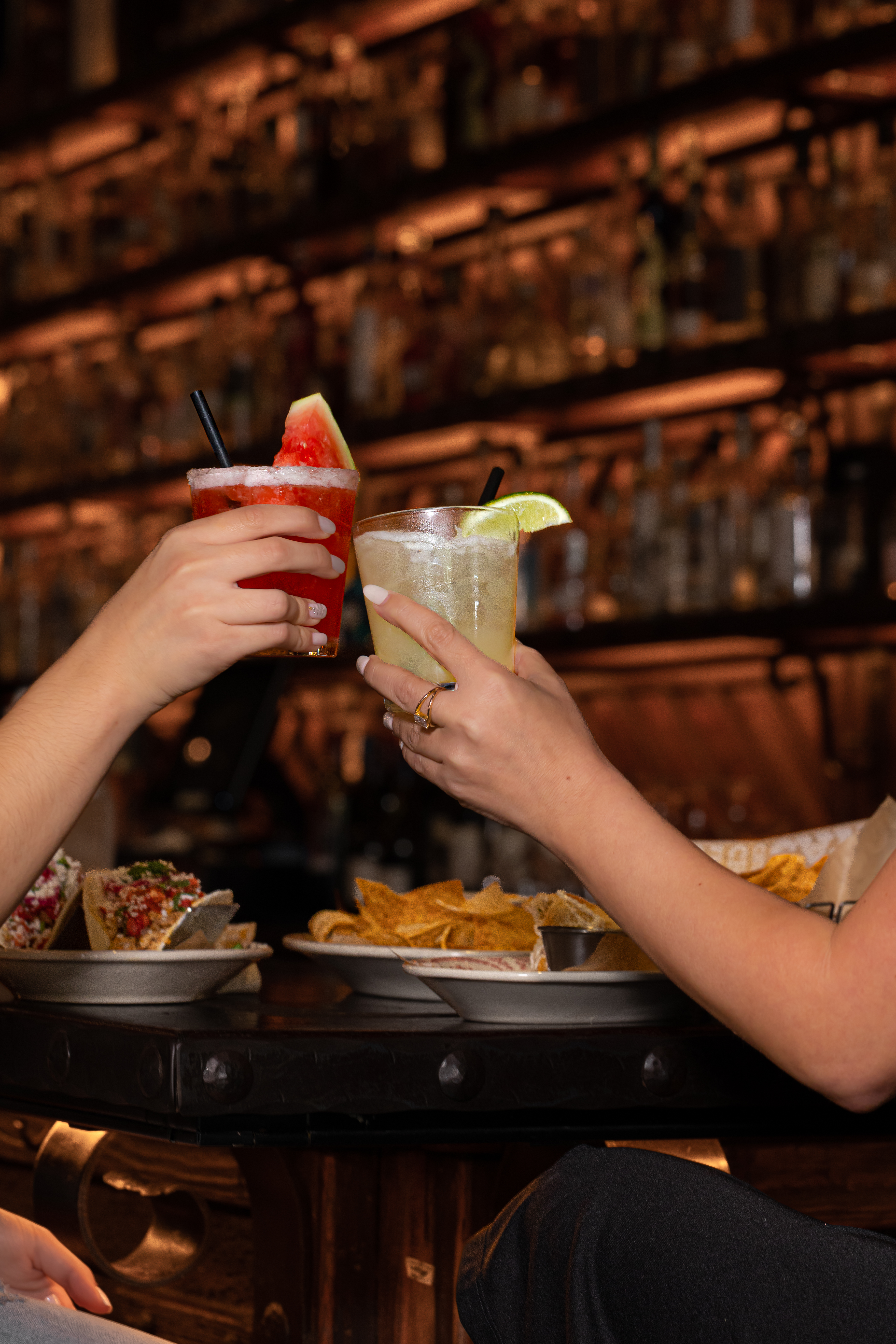 a person sitting at a table eating food