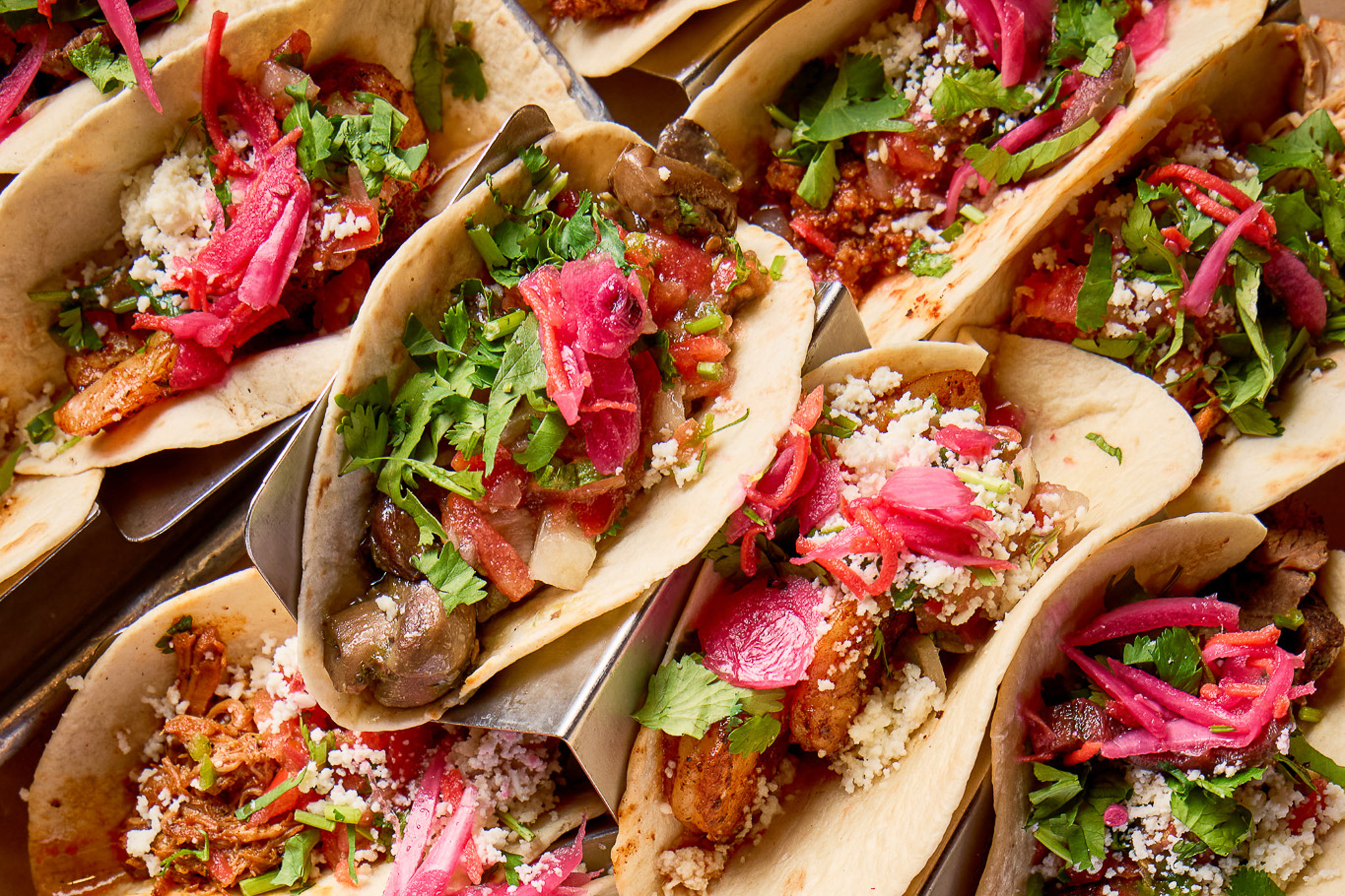Tray of Rocco's De Casa tacos with cilantro, pickled red onion and queso fresco for Taco Tuesday at the Burlington Mall