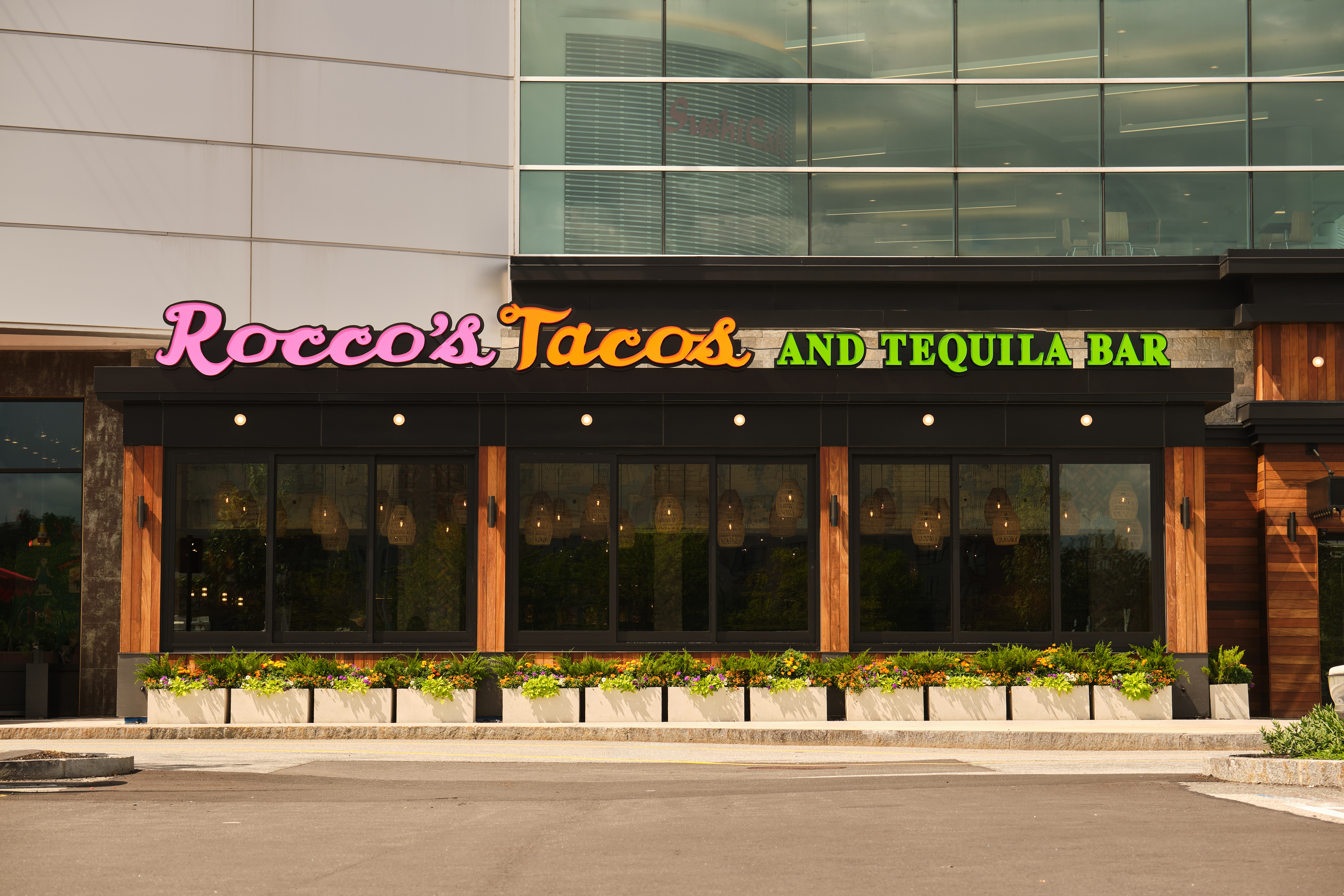 Rocco's Tacos & Tequila Bar storefront with neon sign at the Burlington Mall in Burlington, MA