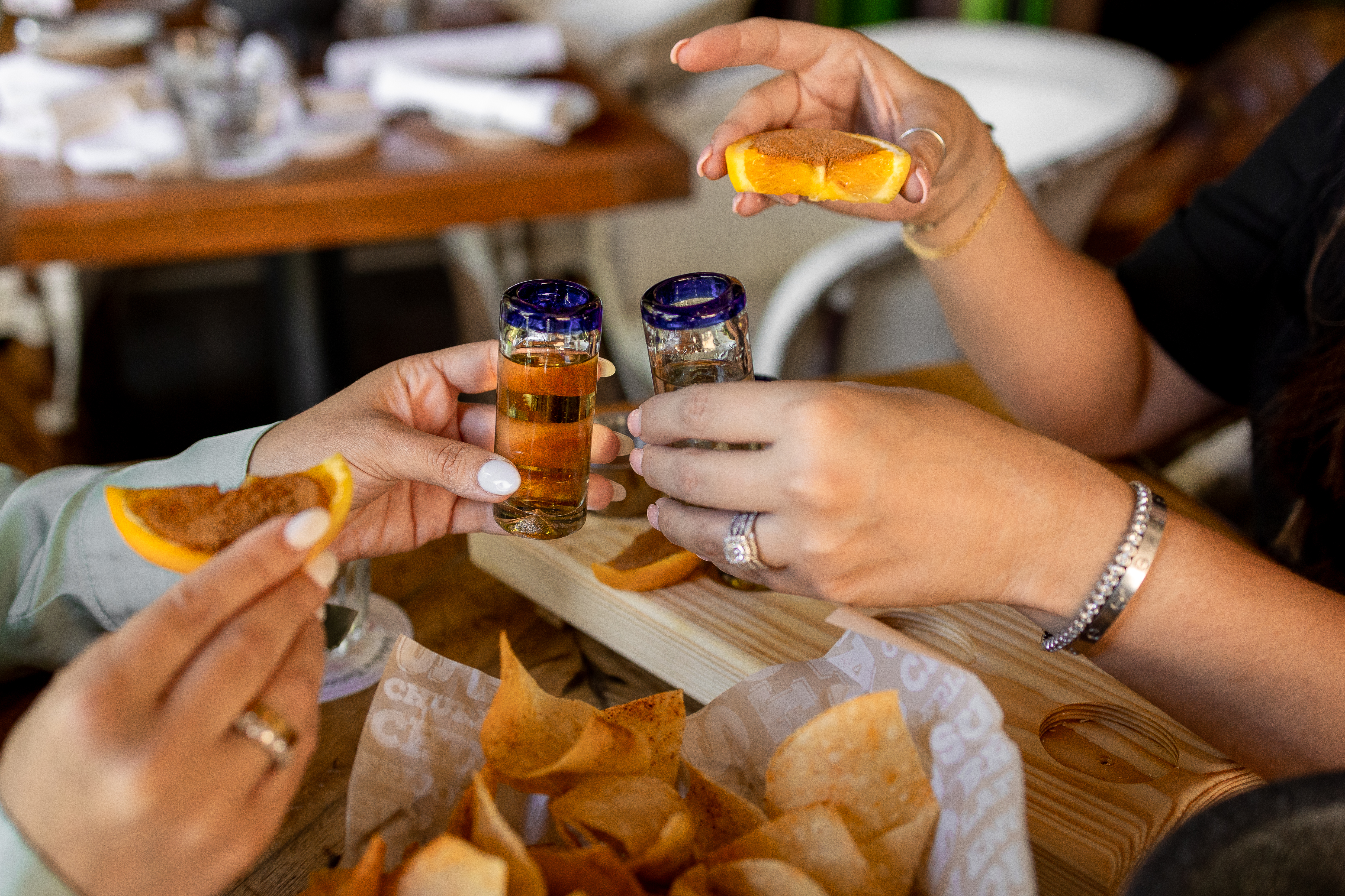 a person sitting at a table eating food