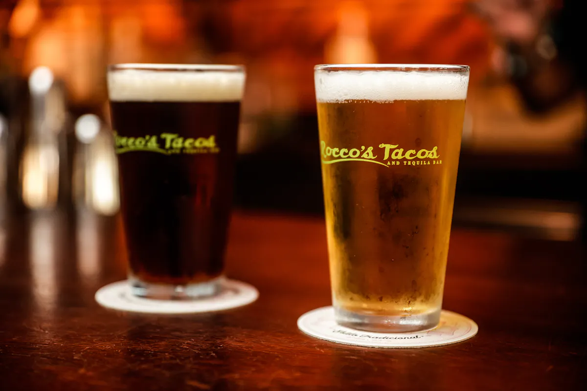 a glass of beer on a table