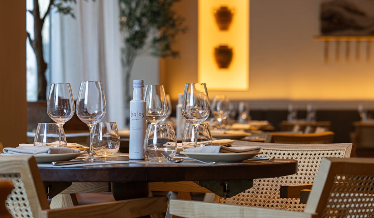 a dining table with wine glasses