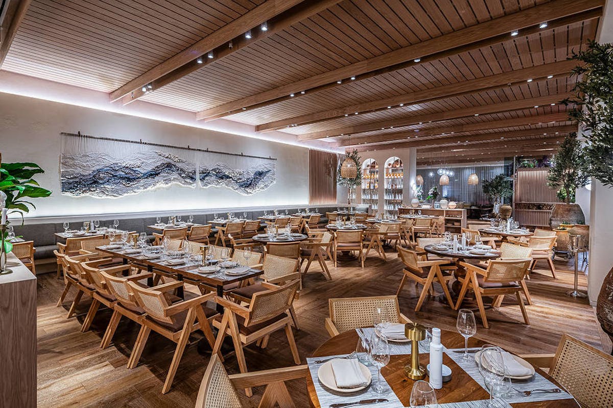 a room filled with furniture on top of a wooden table