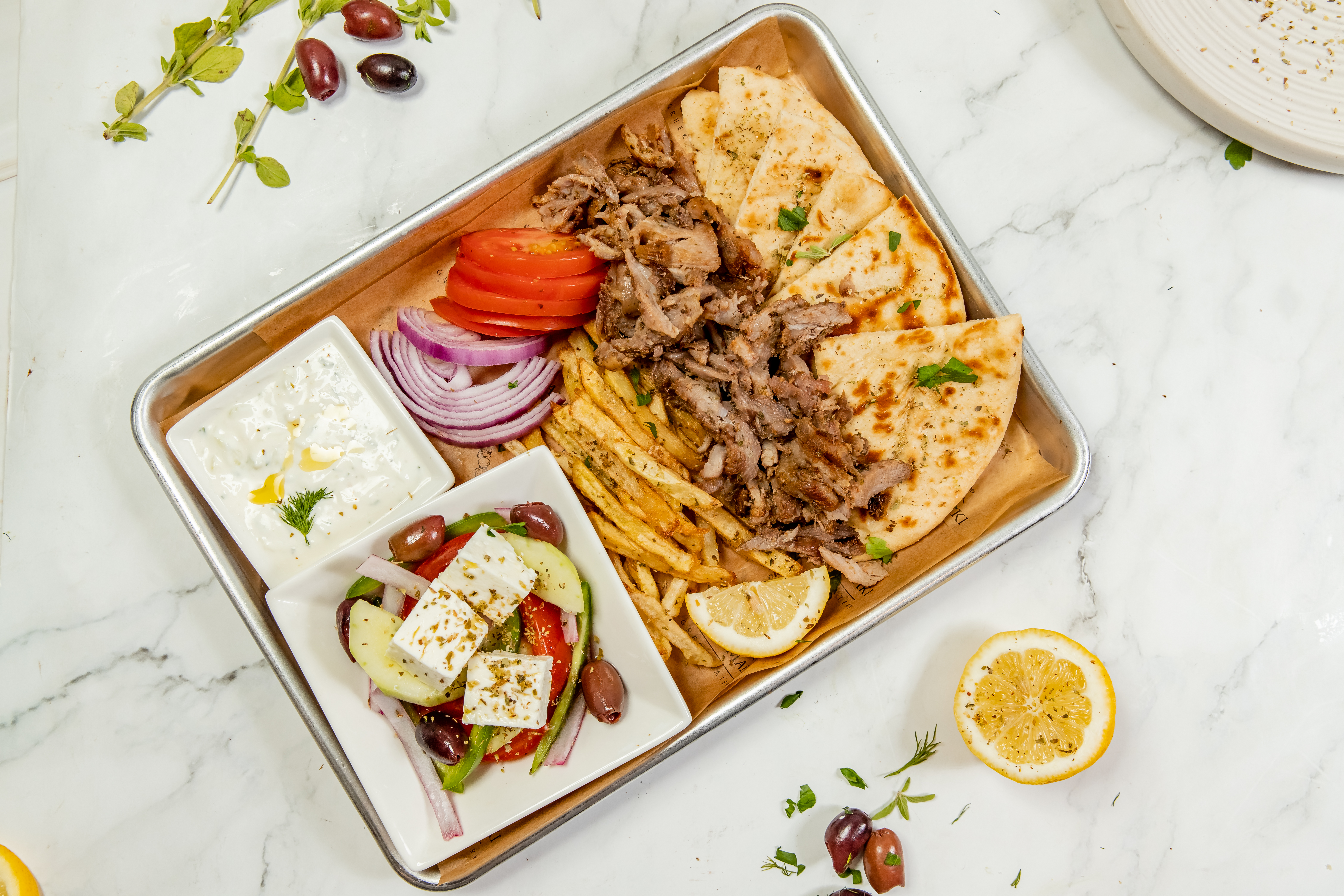a box filled with different types of food on a plate