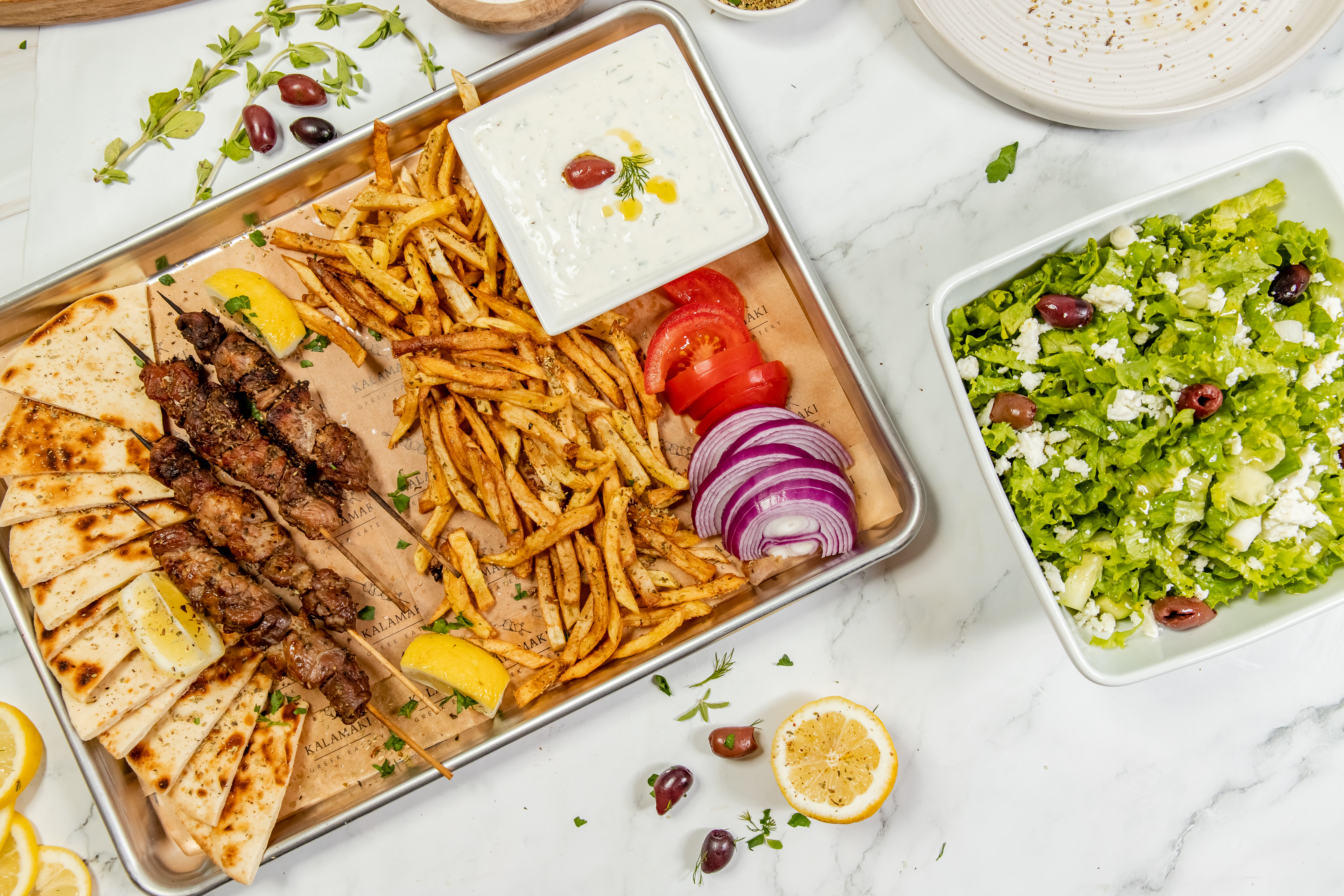 a box filled with different types of food on a plate