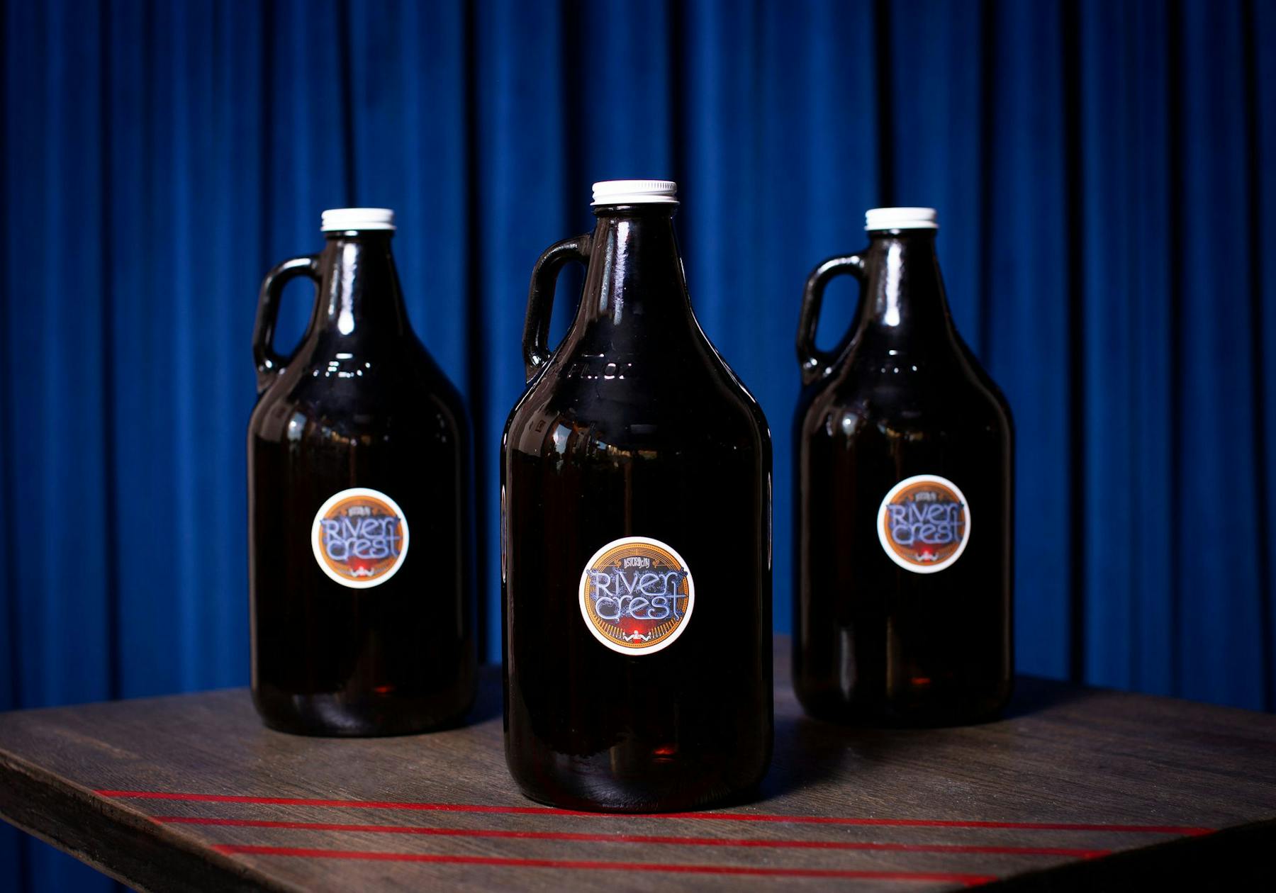 a bottle of wine and a glass of beer on a table