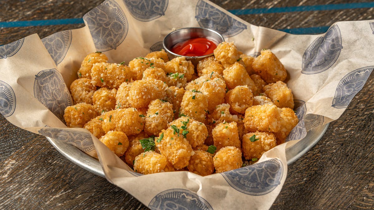 Rivercrest's Parmesan Truffle Tots with parmesan, white truffle oil, fresh herbs
