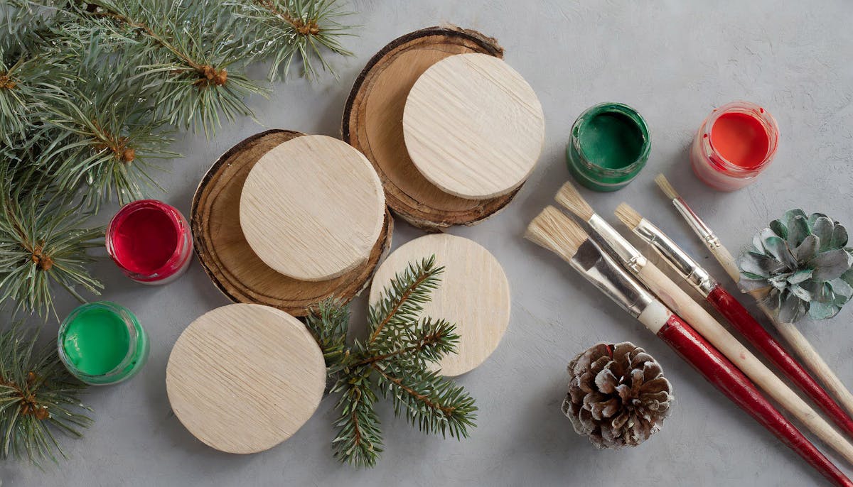 Adult Holiday Ornament Decorating Party at Rivercrest in Astoria with wood round ornaments and paint