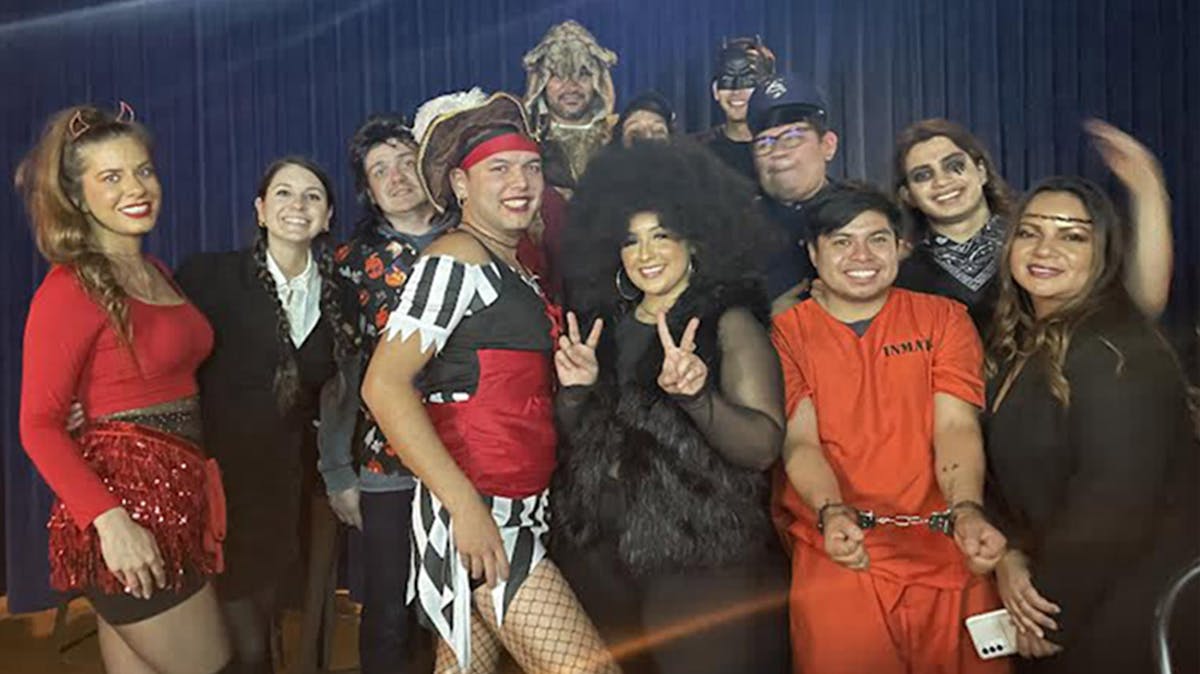 Rivercrest's staff posing for the camera during Rivercrest's Halloween Costume Party in Astoria, Queens