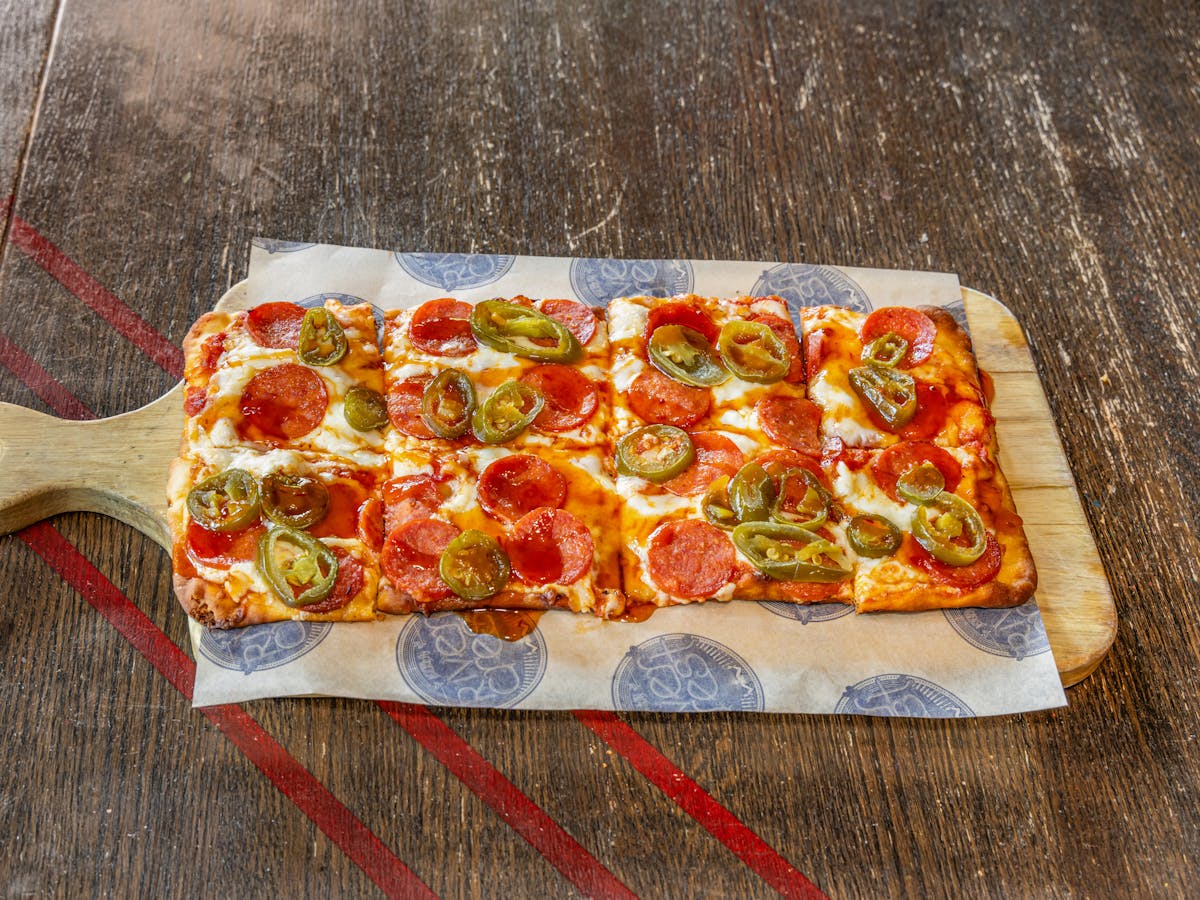 a pizza sitting on top of a table