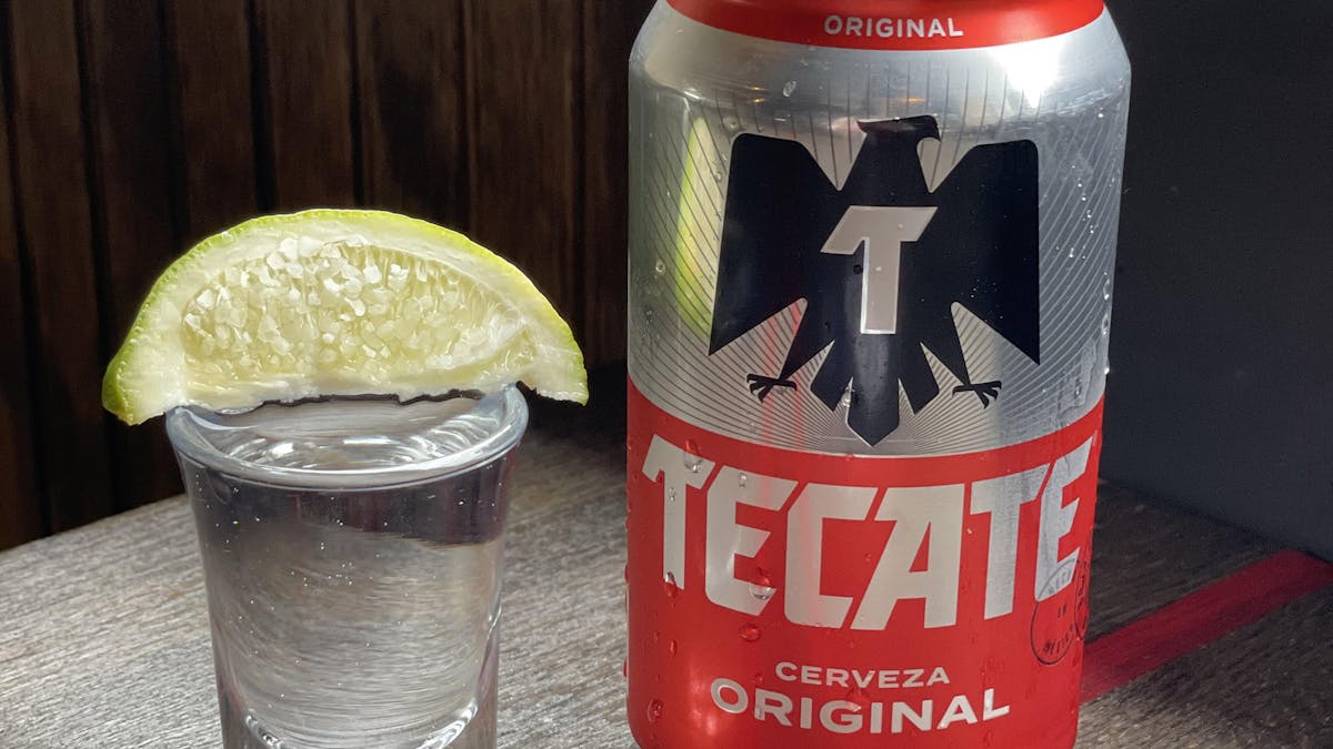 a glass of tequila and can of tecate for Cinco de Mayo at Rivercrest in Astoria, Queens