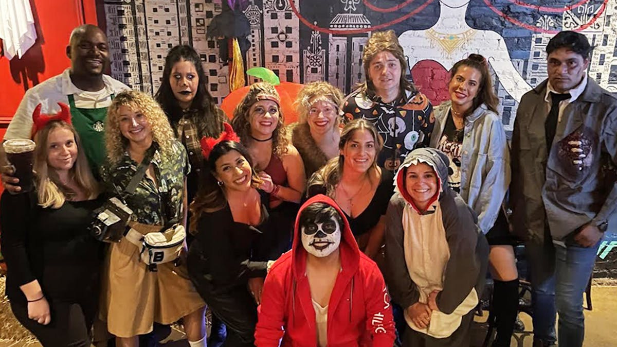 Rivercrest's staff posing for a photo for the Halloween Party