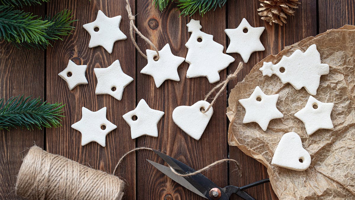 Kids Holiday Ornament Decorating Party at Rivercrest in Astoria, Queens with white clay ornaments with fun shapes