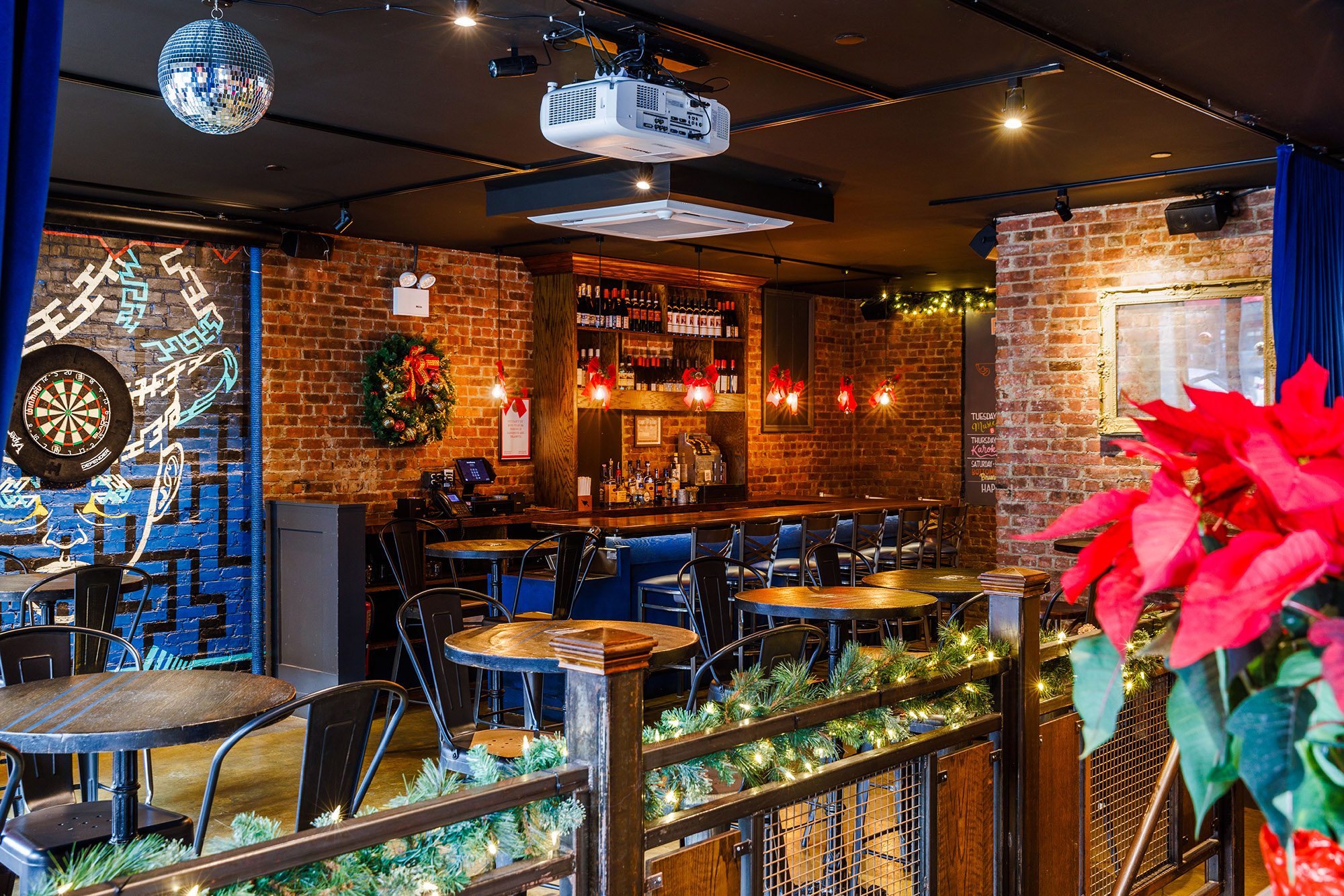 Rivercrest's private cocktail bar with darts is fully decorated for Christmas in December on Ditmars Blvd in Astoria, Queens