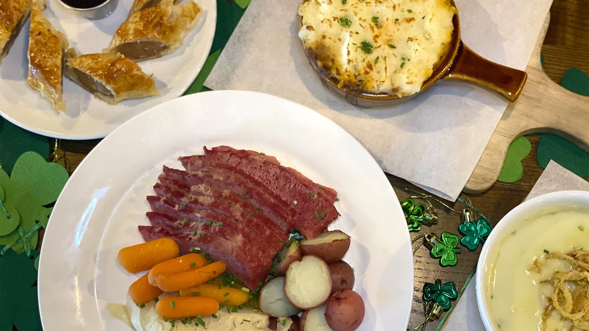4 dishes of St. Patrick's Day specials with decorations on a table in Astoria