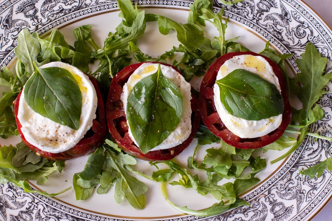 a plate of food with a green salad