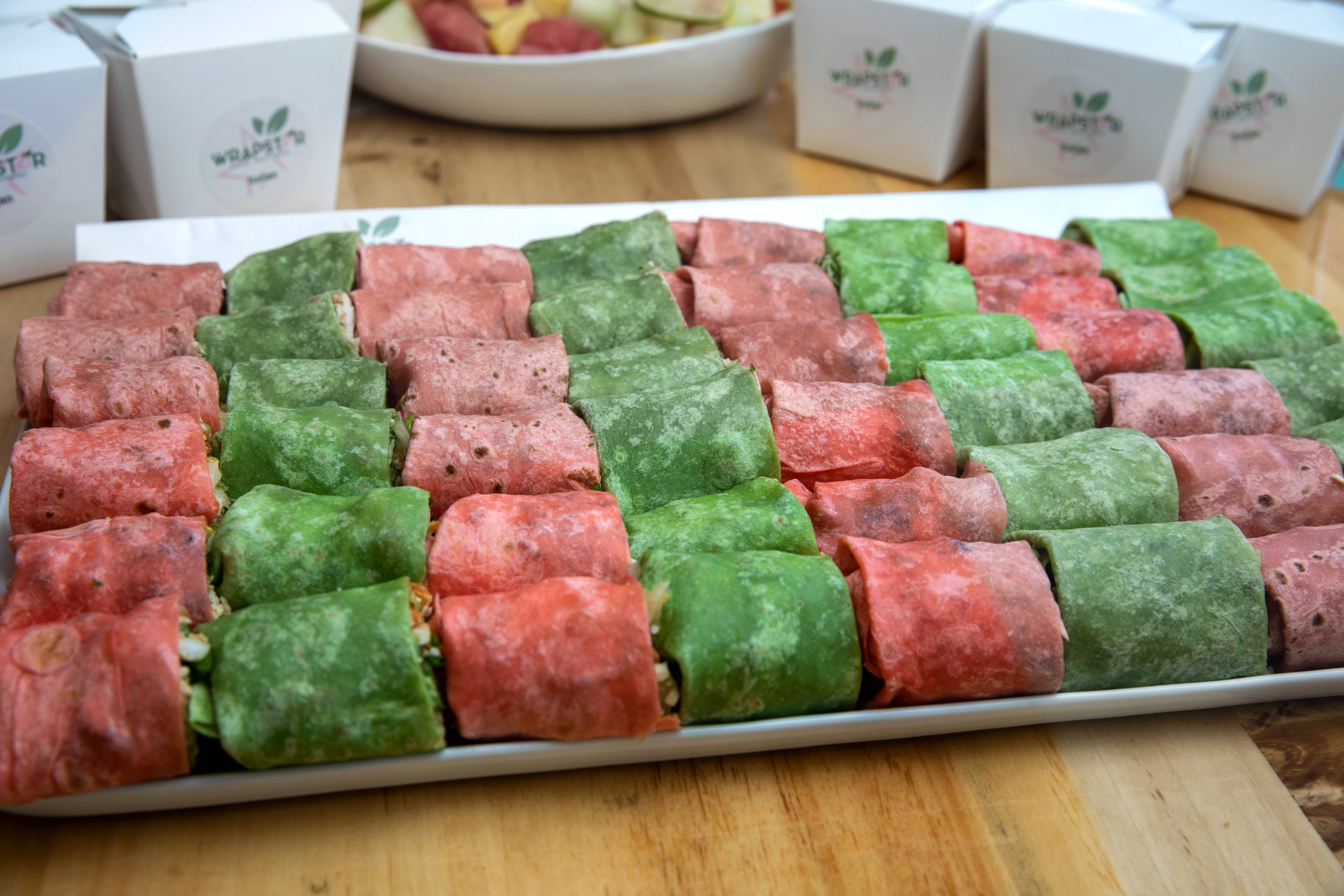 a bunch of food sitting on top of a wooden table