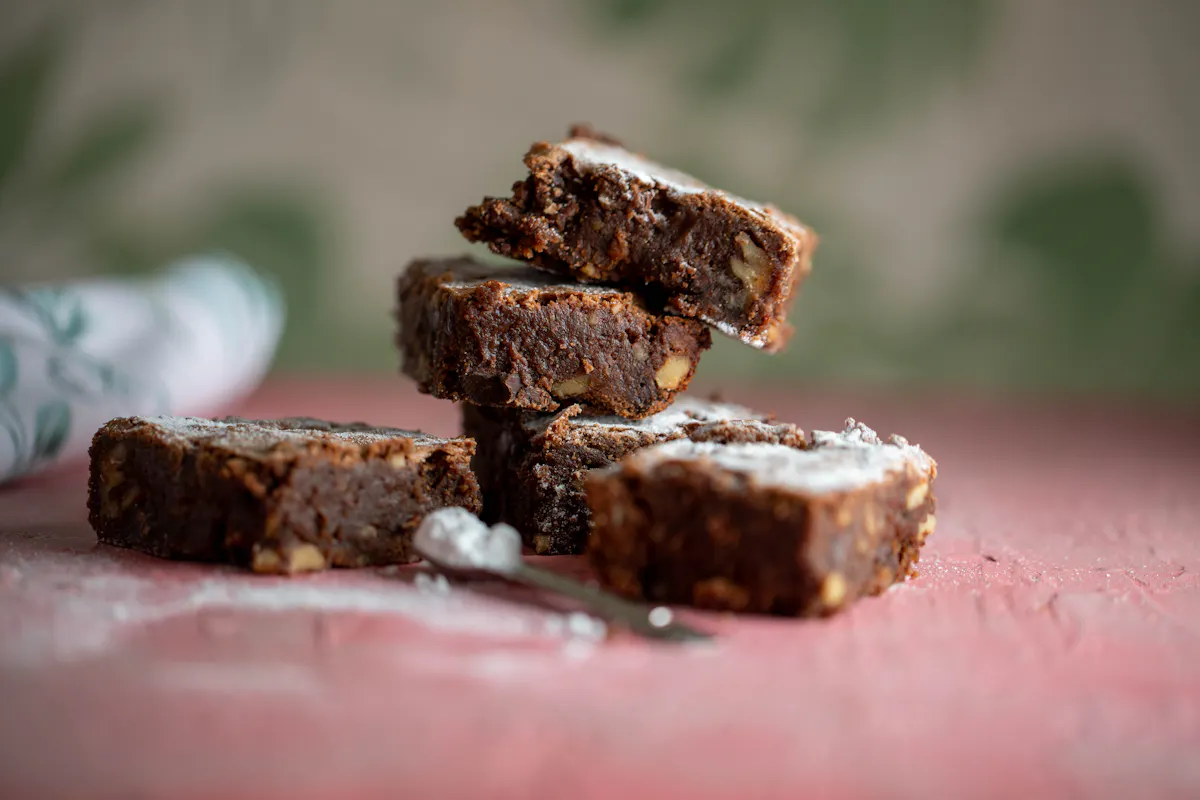a piece of chocolate cake with a slice cut out