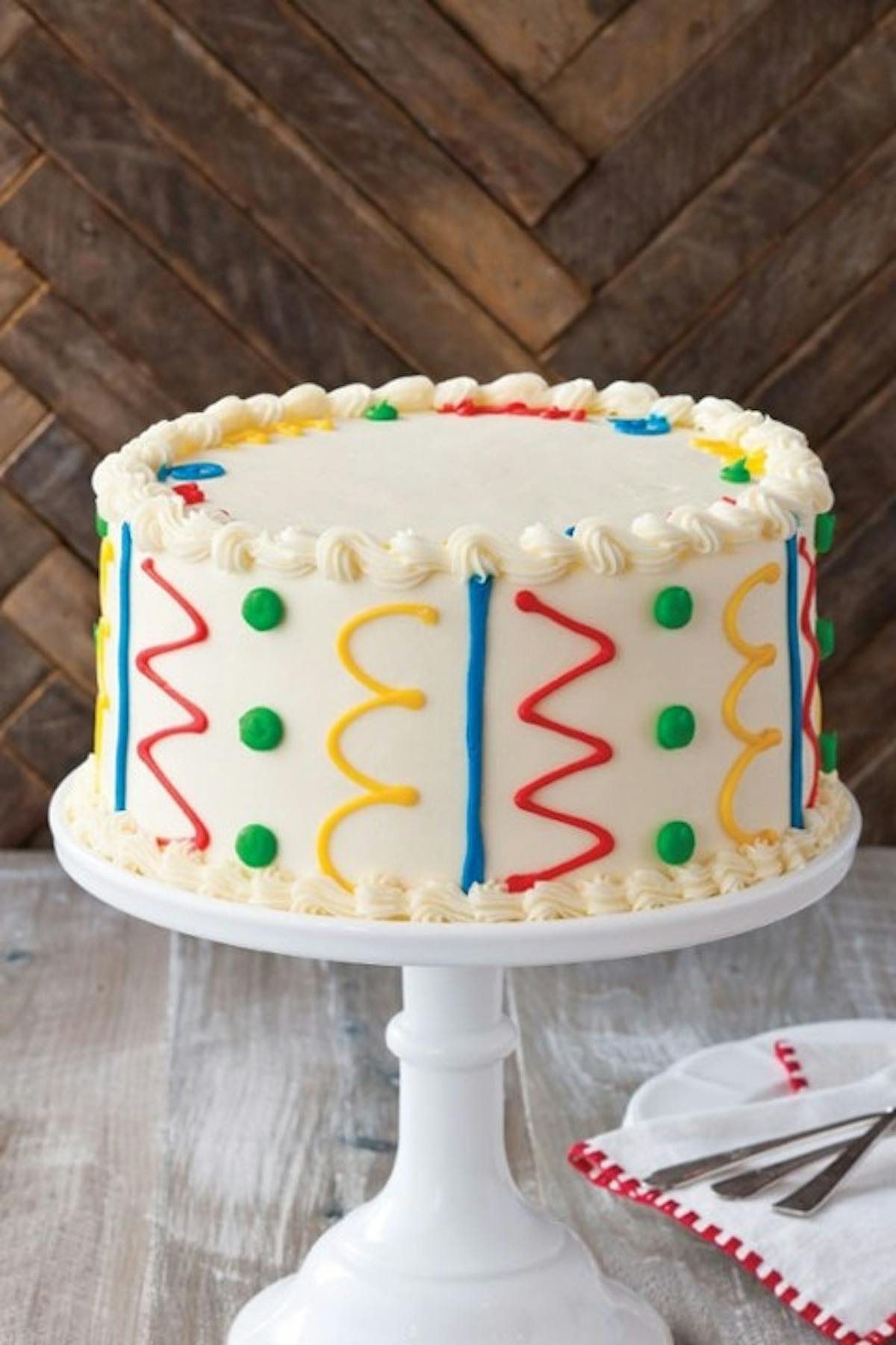 a cake sitting on top of a wooden table