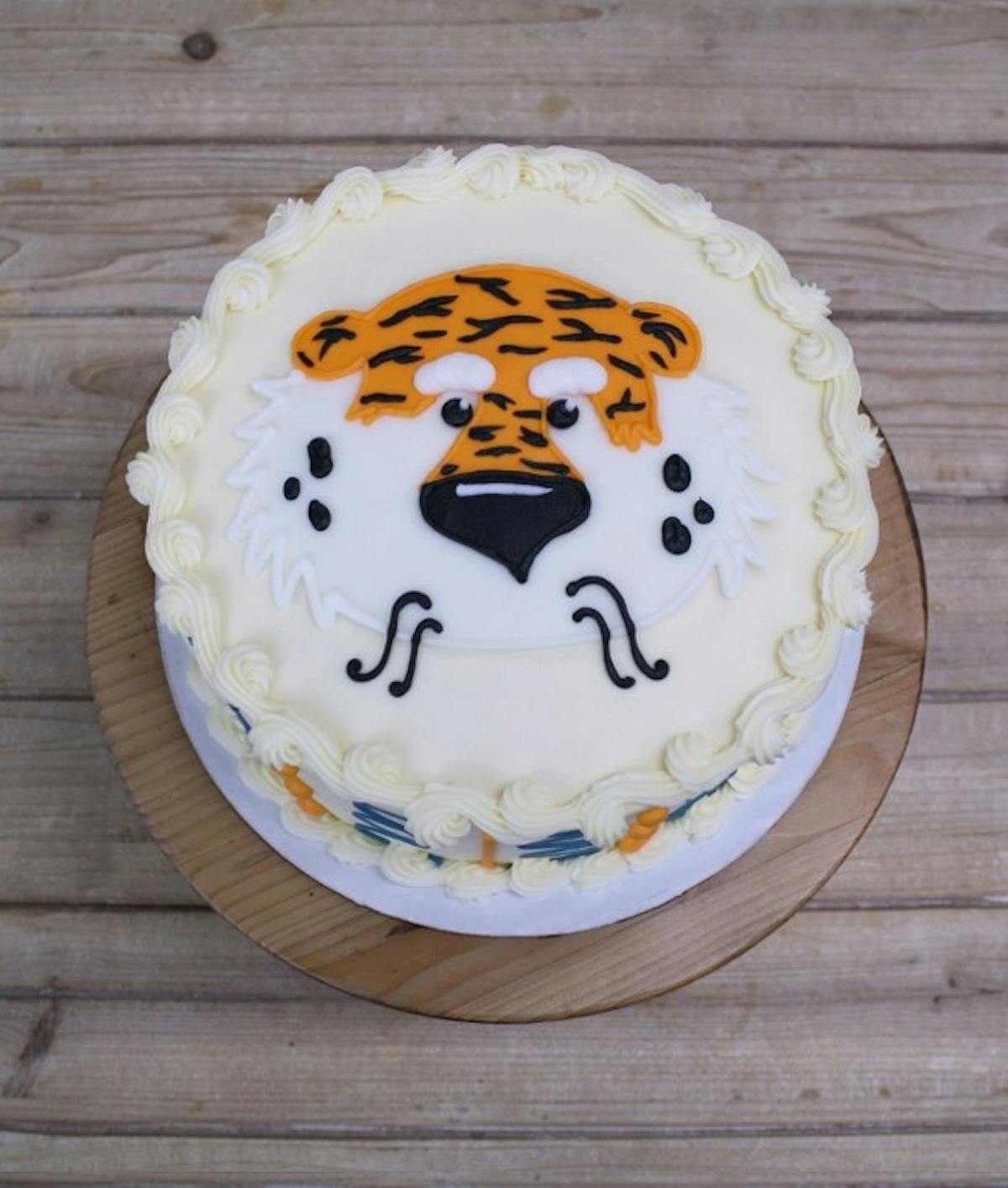 a cake sitting on top of a wooden table
