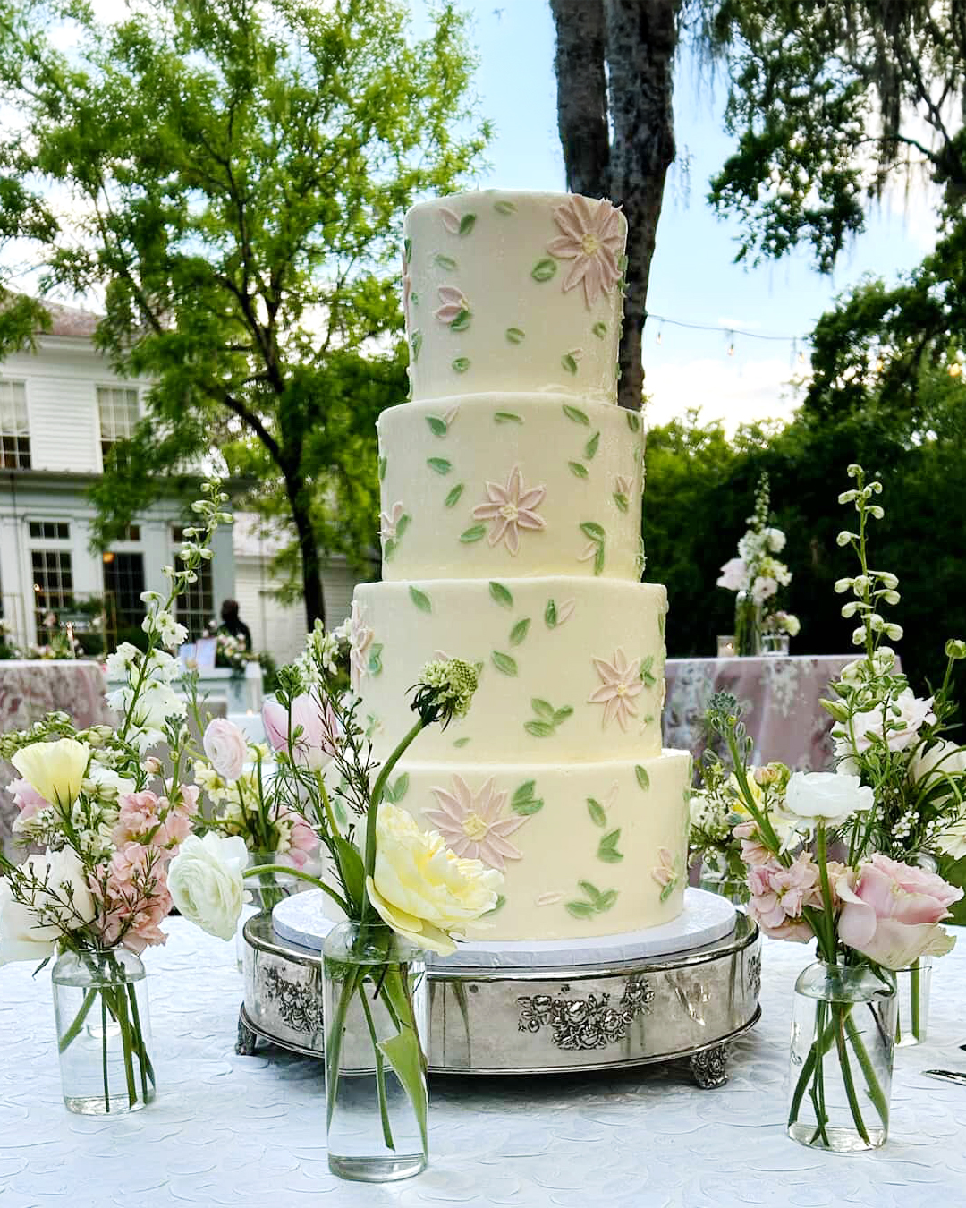 Tiered white wedding cake by Edgar's Bakery