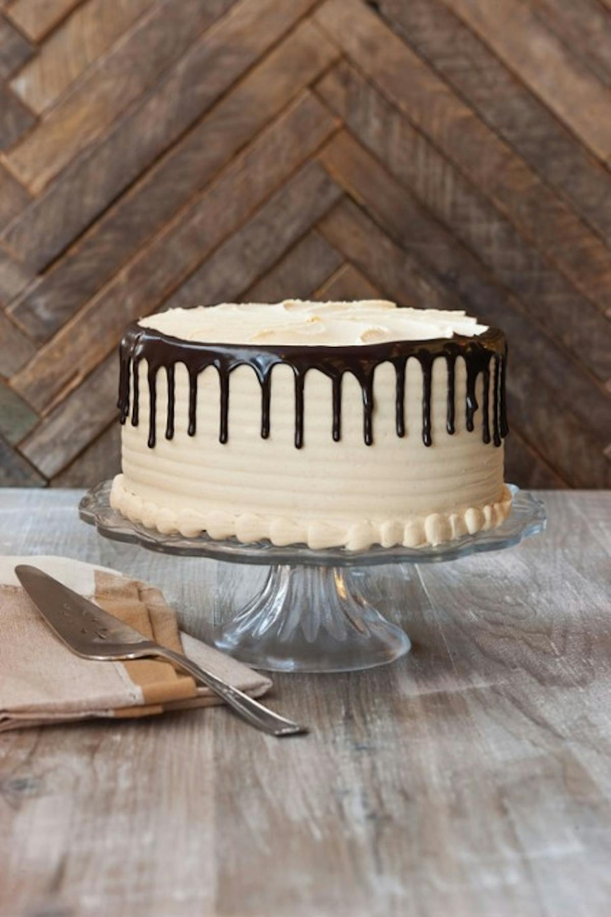 a slice of cake sitting on top of a wooden cutting board