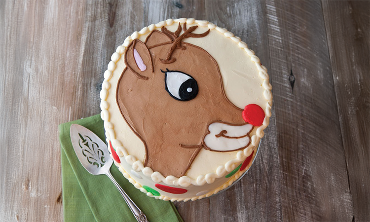 a cake sitting on top of a wooden table