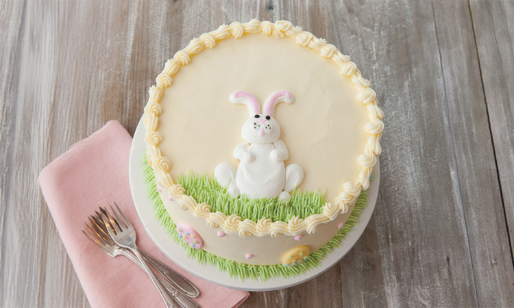 a cake with fruit on top of a wooden table