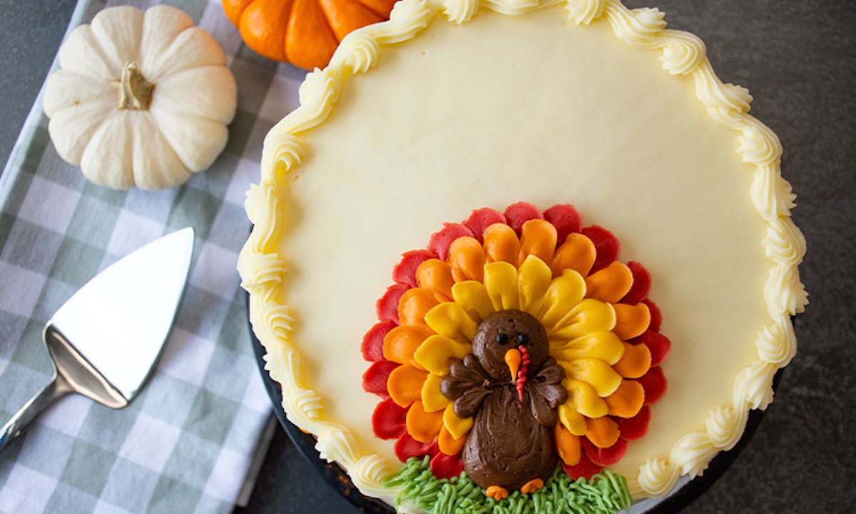 a cake with fruit on top of a table
