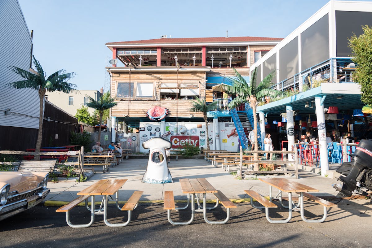 a group of people riding on the back of a bicycle