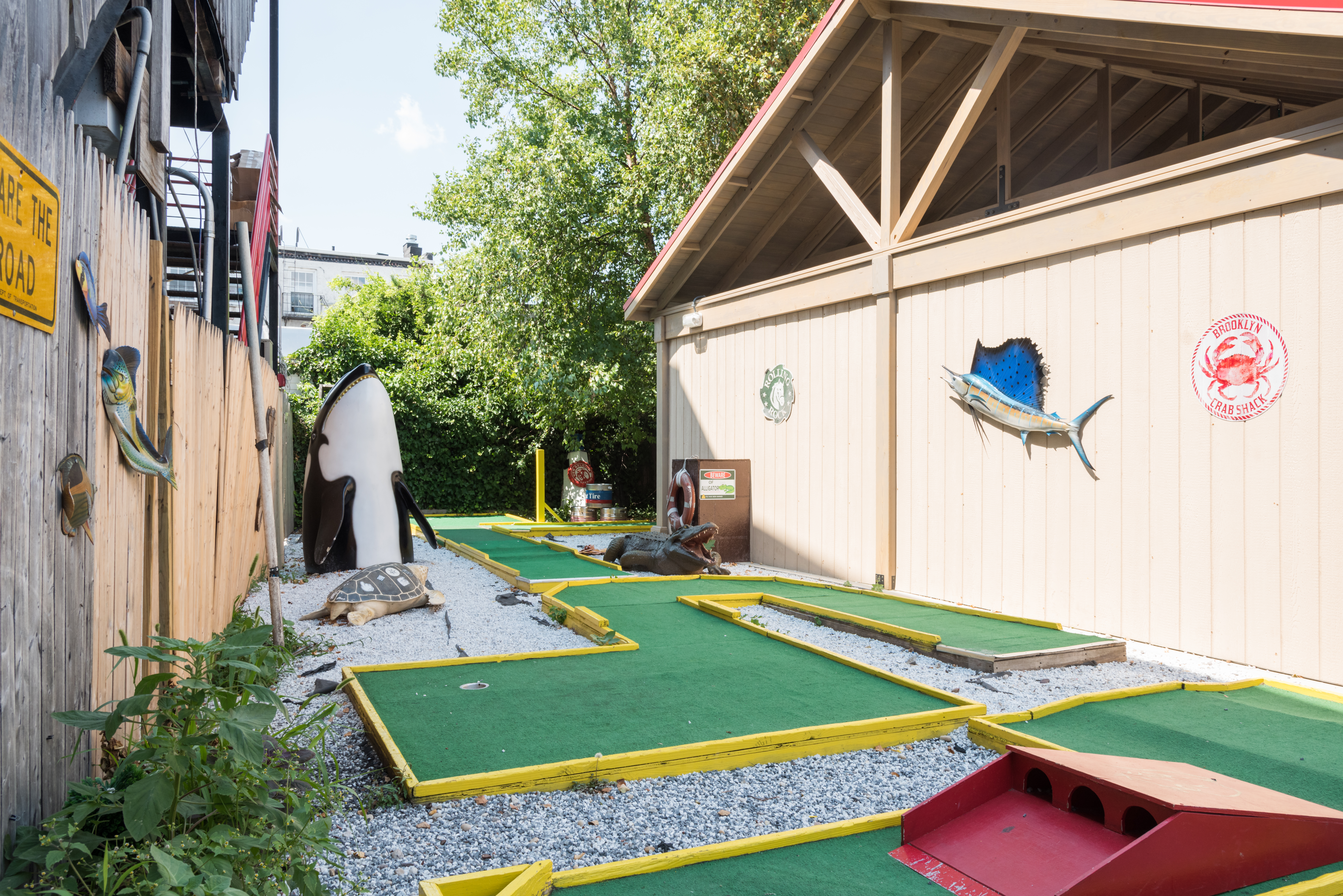 a house that has a sign on the side of a building