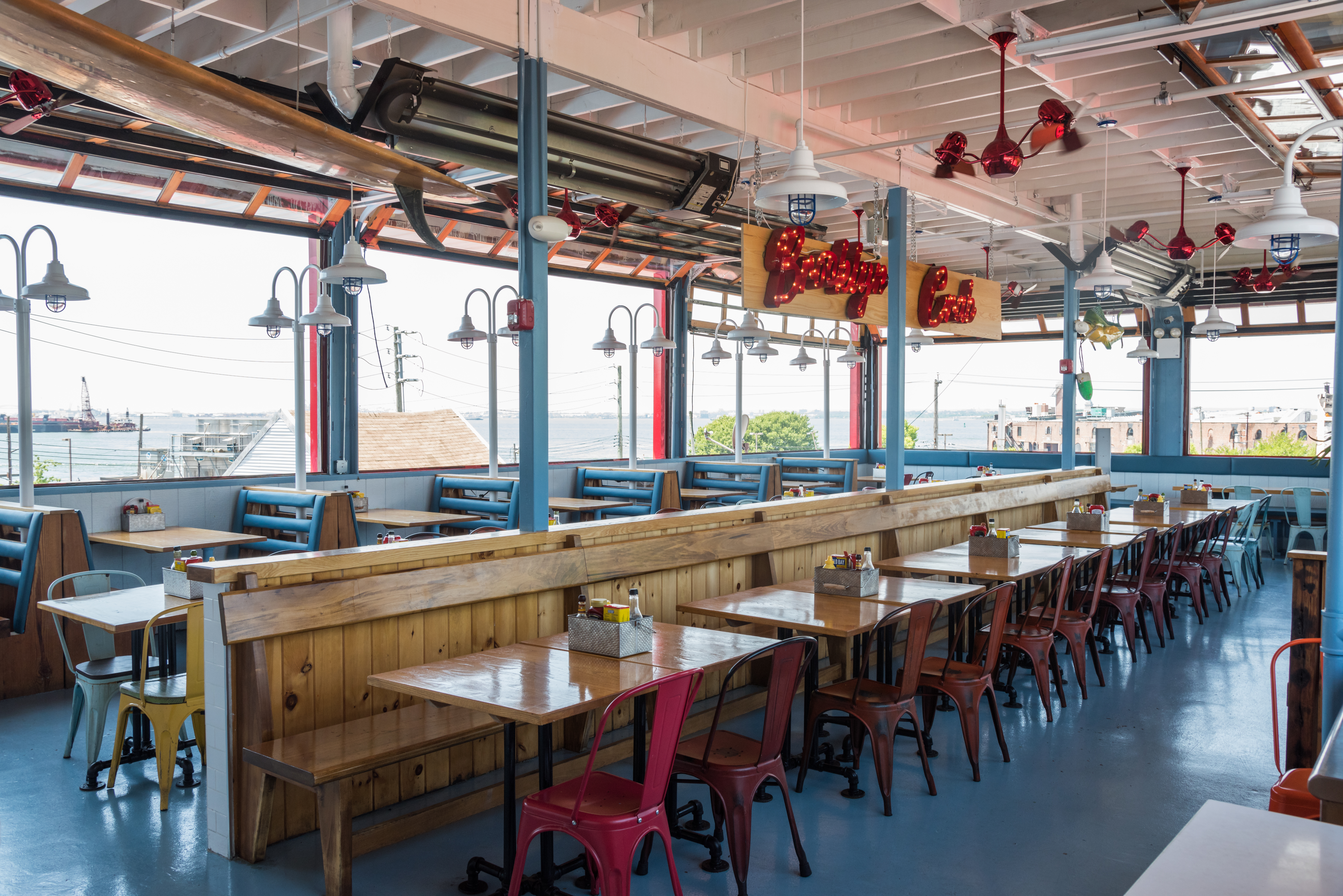 a group of people sitting at a table in front of a building