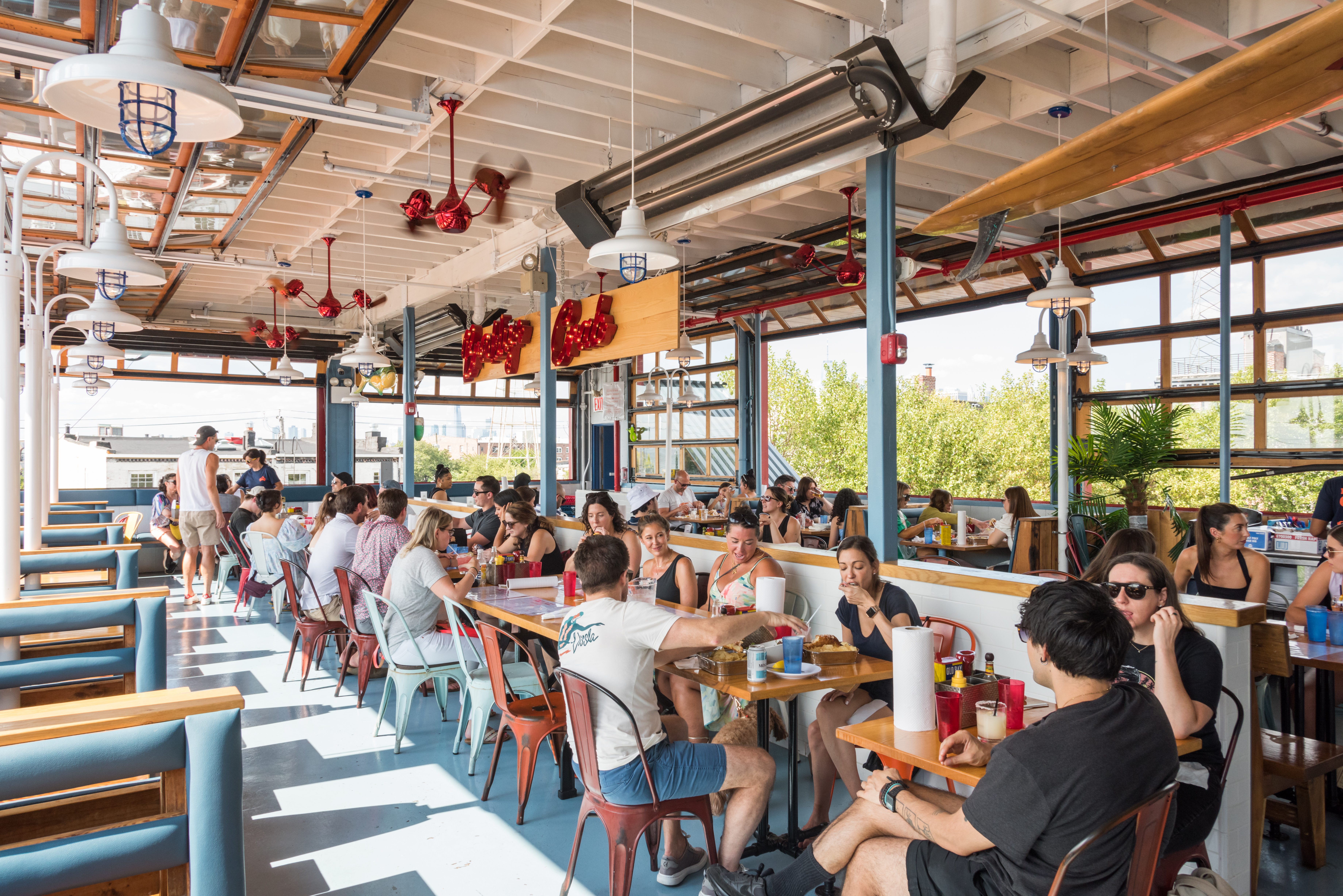 a group of people sitting at a table in a restaurant