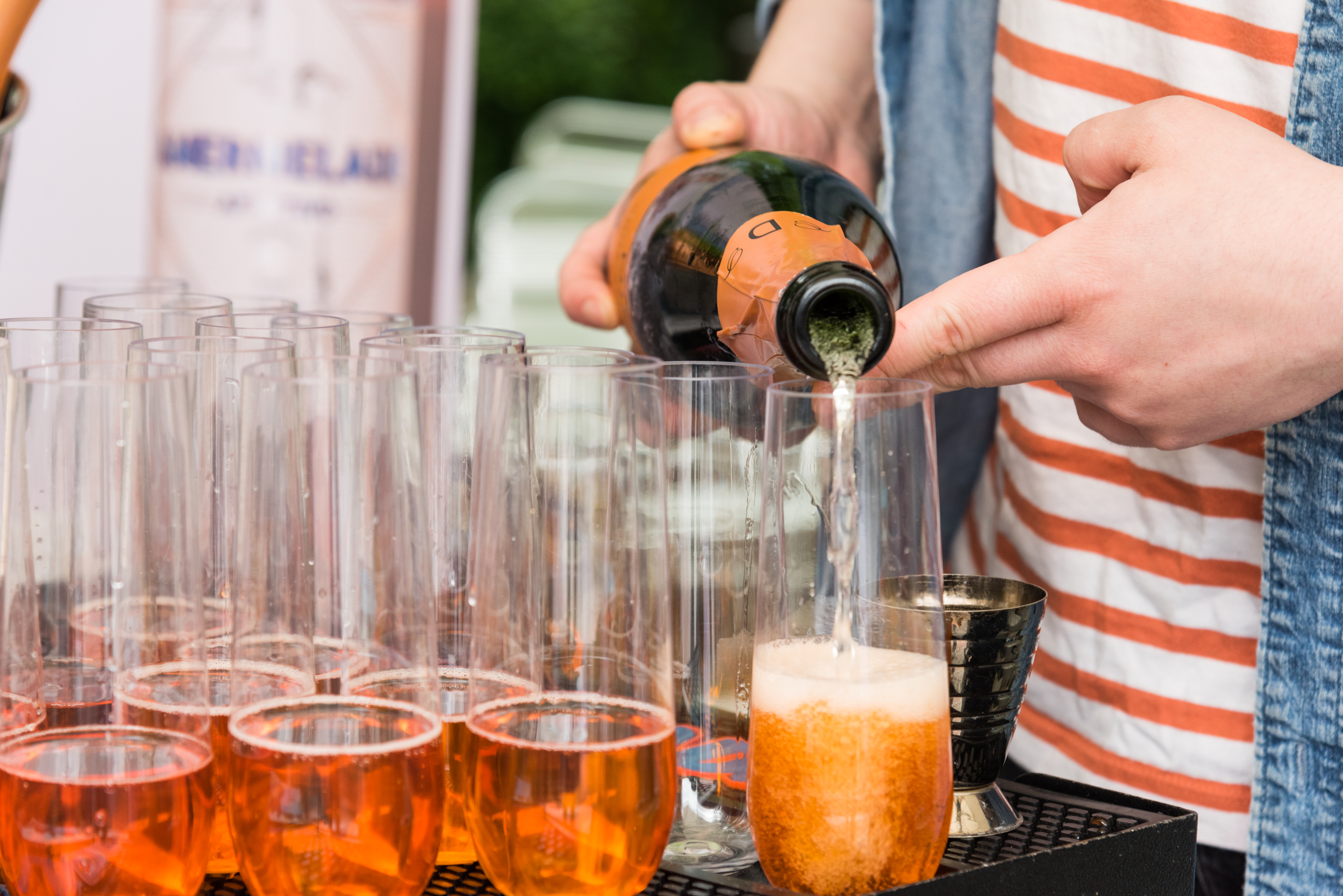 a group of people holding glasses of beer on a table