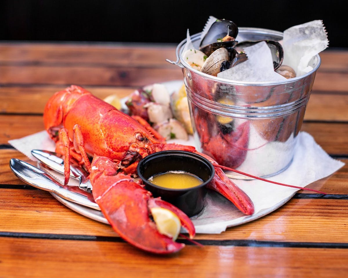 a cup of coffee sitting on top of a wooden table