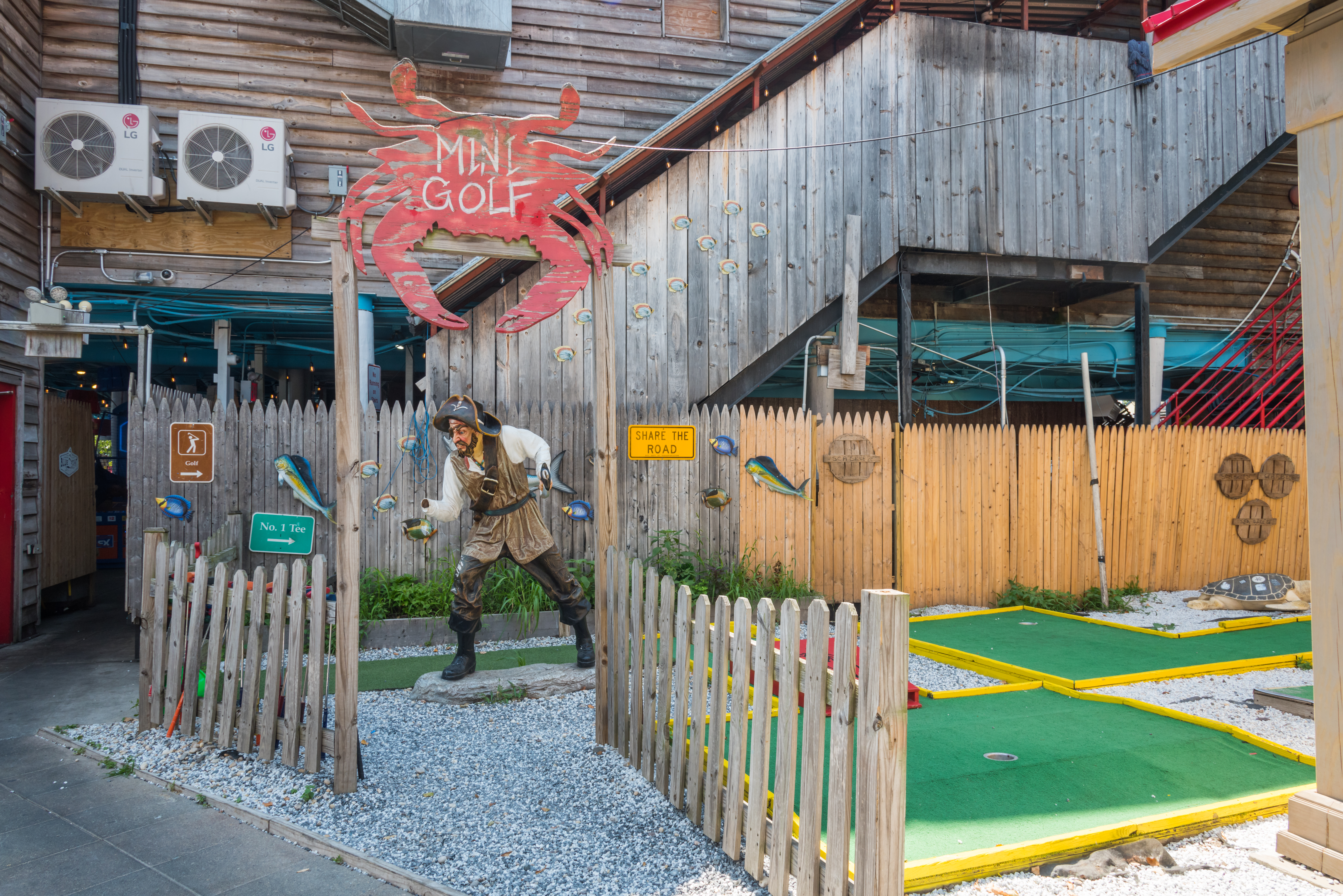 a building with a wooden fence
