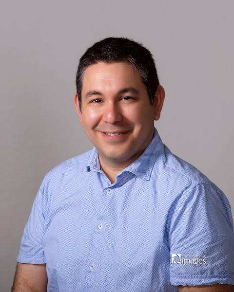 a man wearing a blue shirt