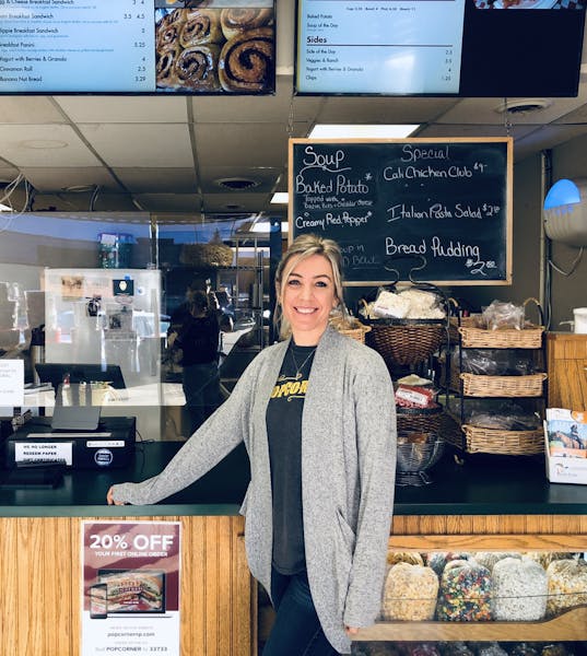 a person standing in front of a store