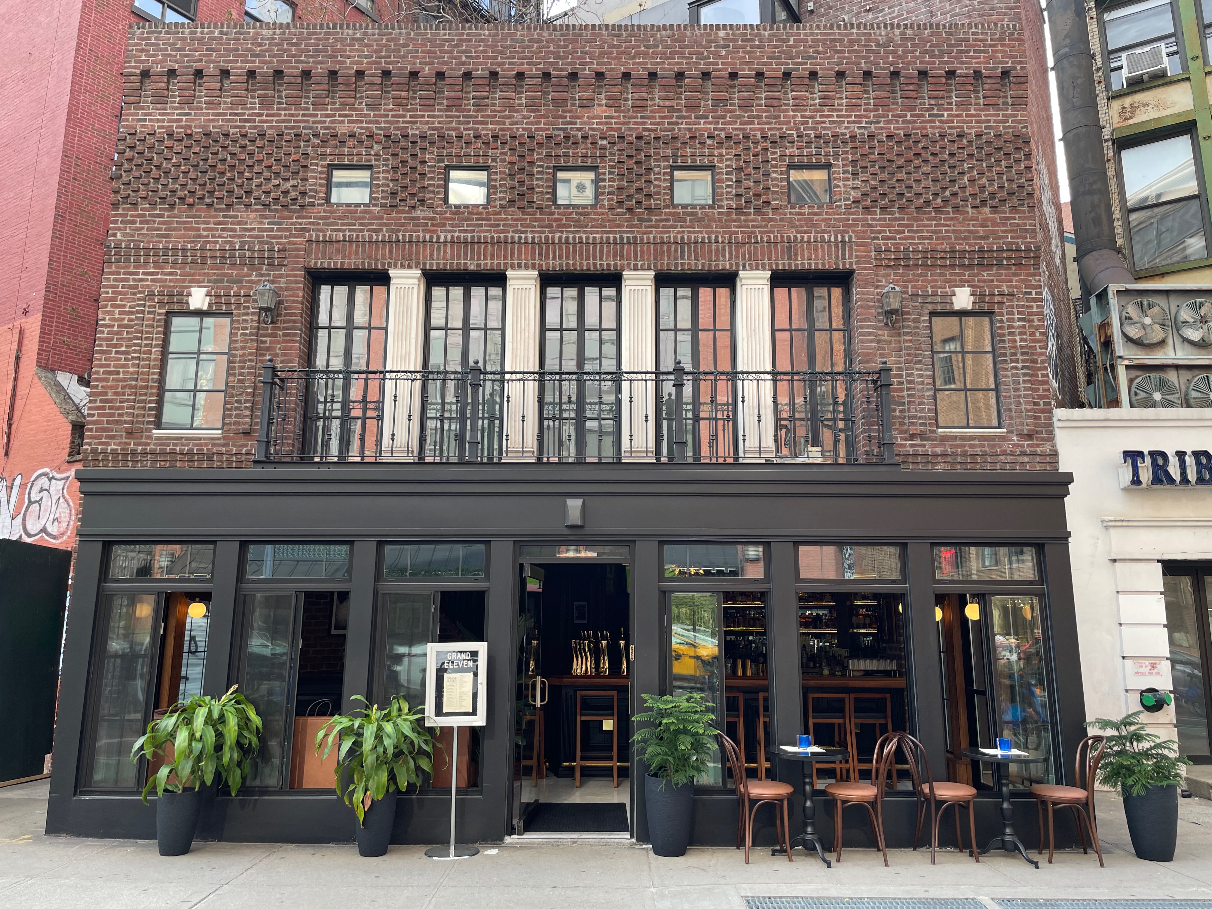 a group of people in front of a building