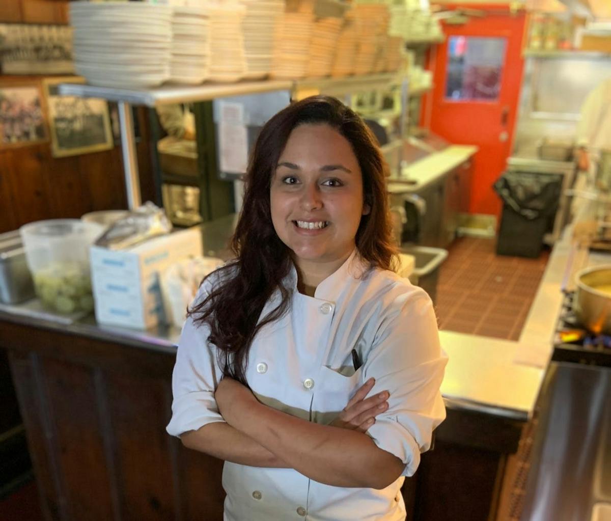 a person standing in a kitchen
