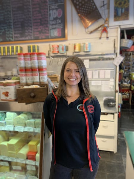 a person standing in front of a store