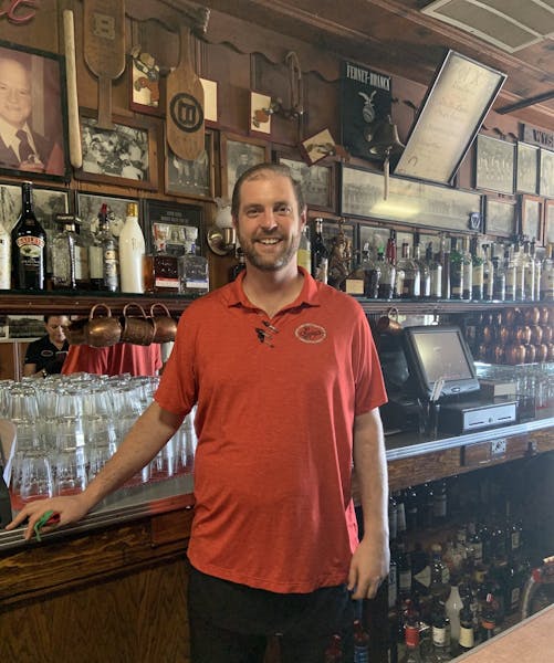 a man standing in front of a store