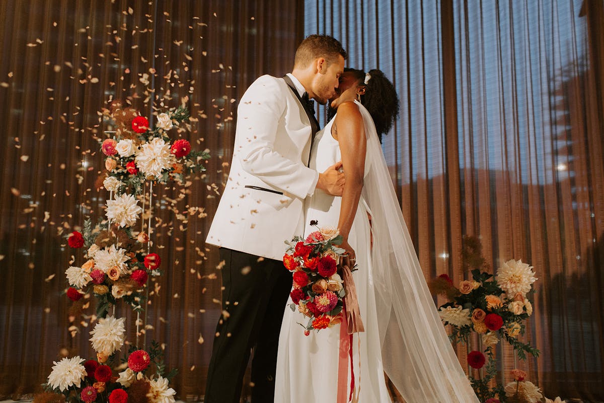 a person standing in front of a curtain