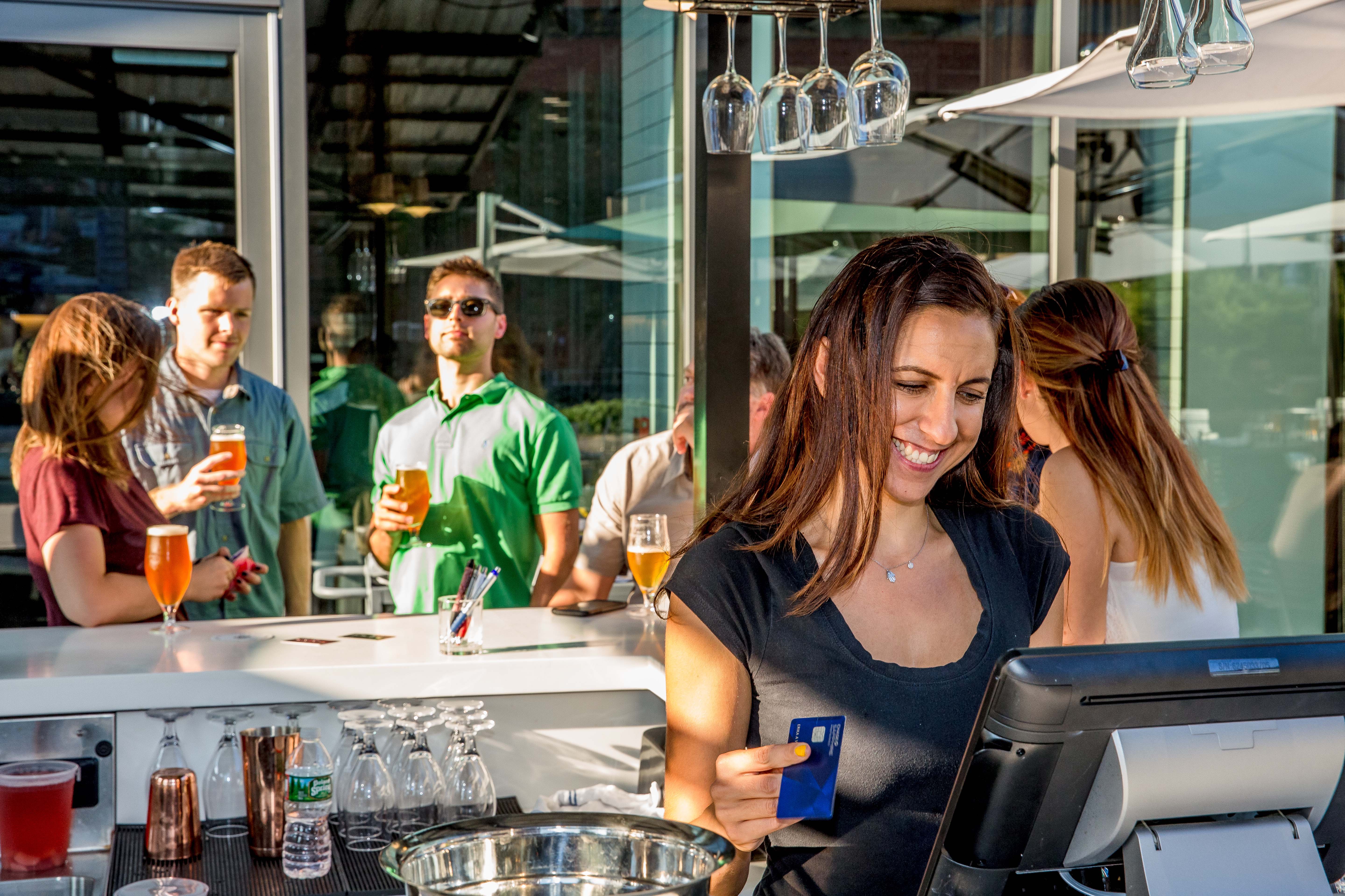 a group of people sitting at a table in a restaurant