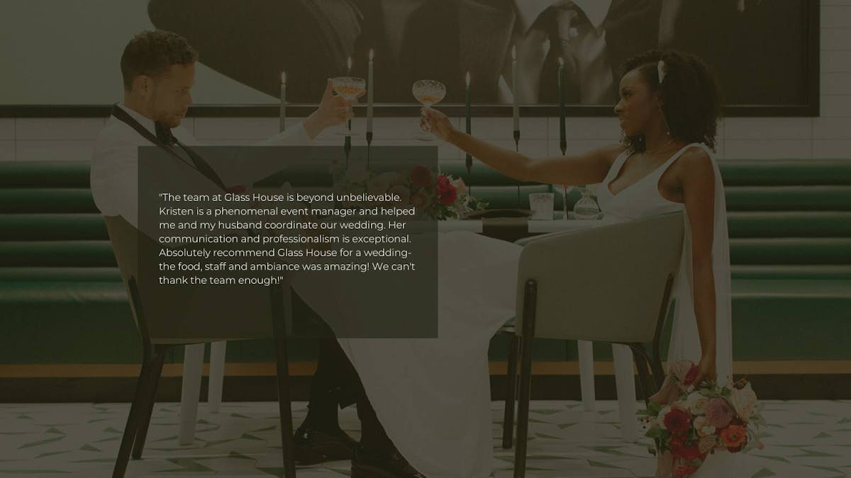 a person sitting at a table in front of a piano