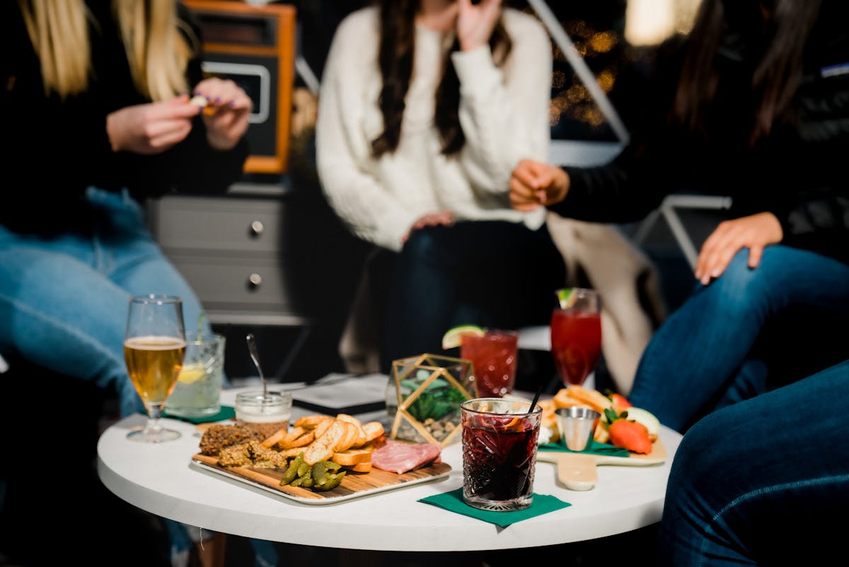 a person sitting at a table with food