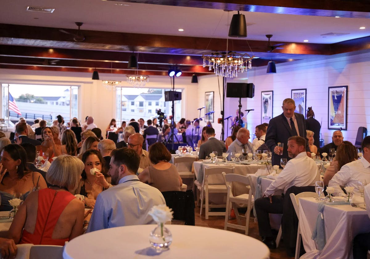 a group of people sitting at a table in a restaurant