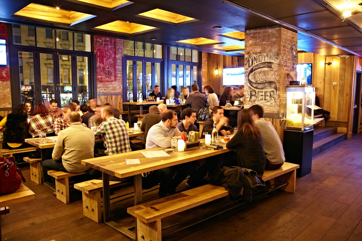 photo of the restaurant, people eating and talking at the tables