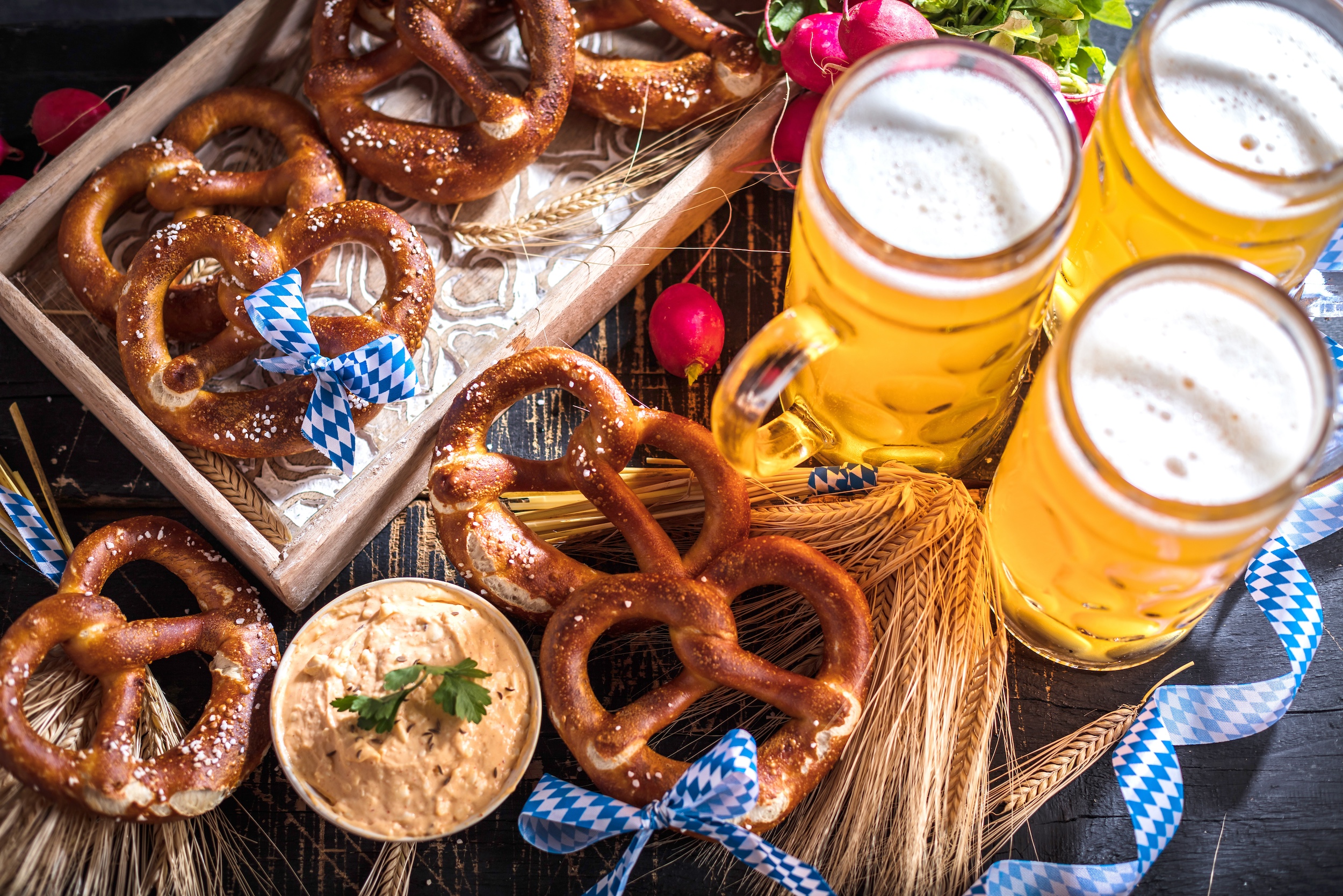 Beer steins lined up on tables during Oktoberfest.