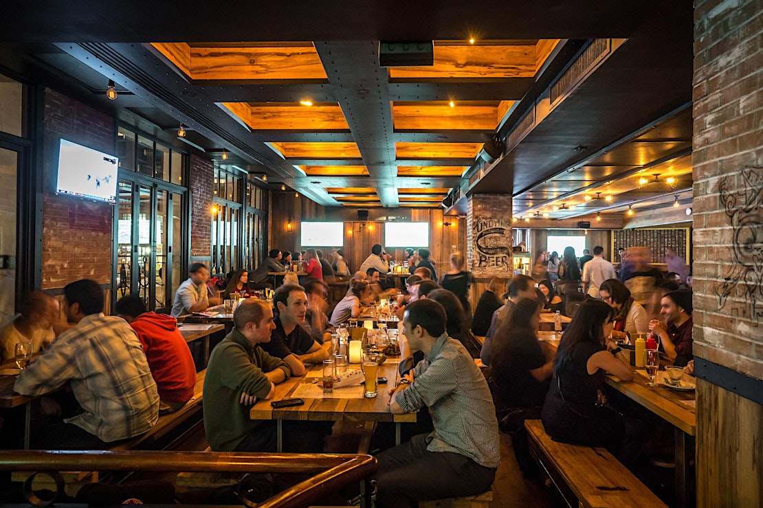 Guests watching the game on multiple screens at Treadwell Park UES